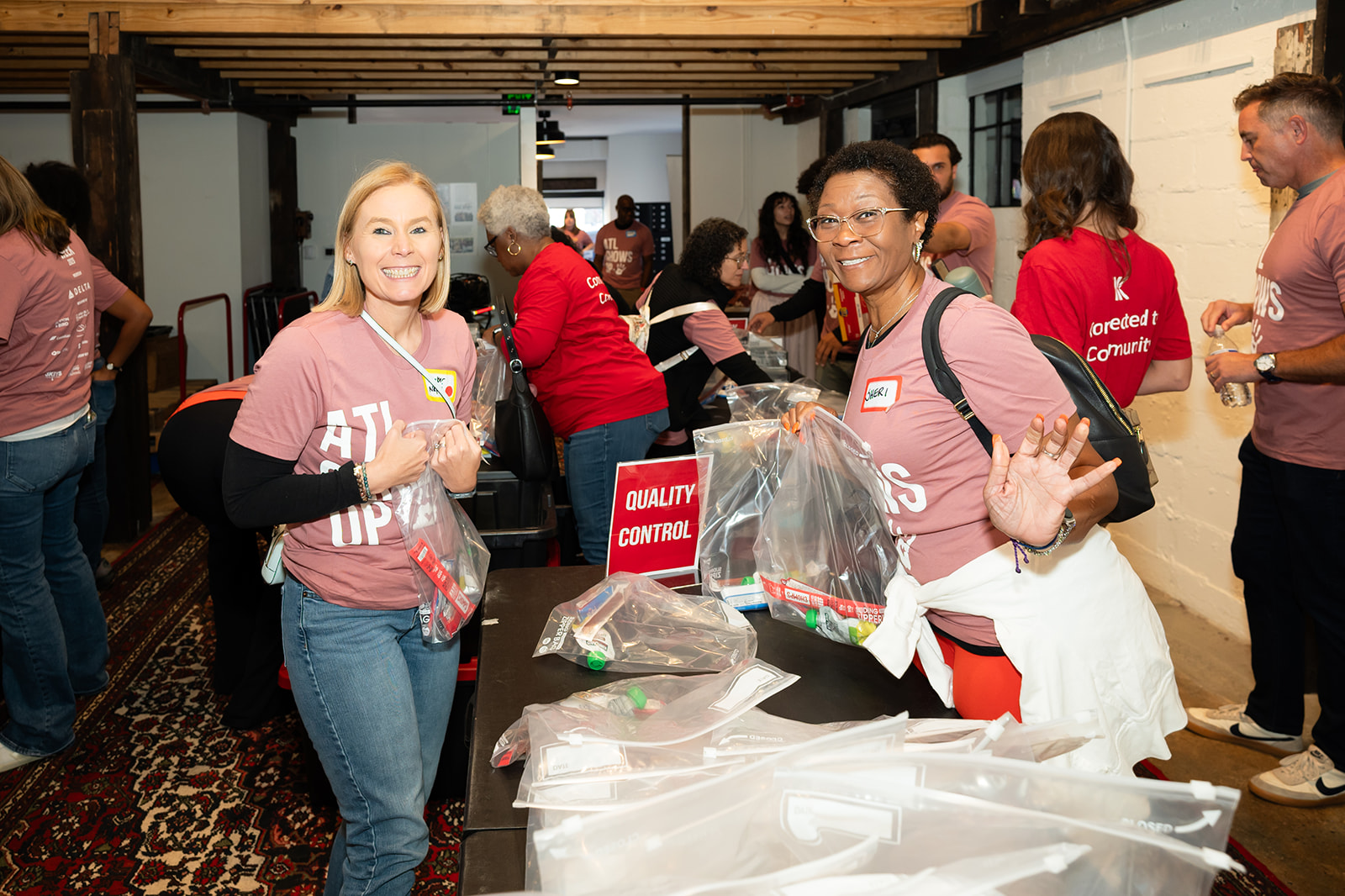 Two volunteers packing hygiene kits at Hands On Atlanta Week 2026 benefitting 3Keys and Welcome House