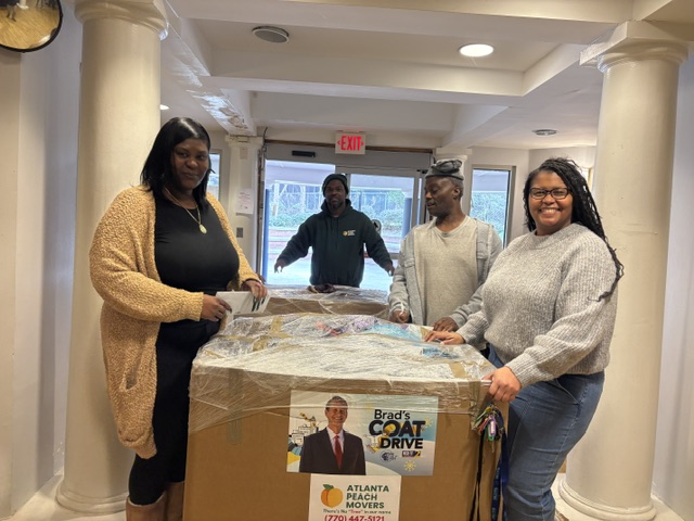 3Keys staff receives five large boxes of donated coats and rain gear to help people who have experienced homelessness.