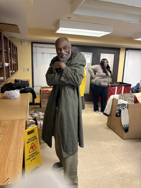 A 3Keys resident of Welcome House in Atlanta tries on his new coat from WSB-TV's Brad Nitz Coat Drive.