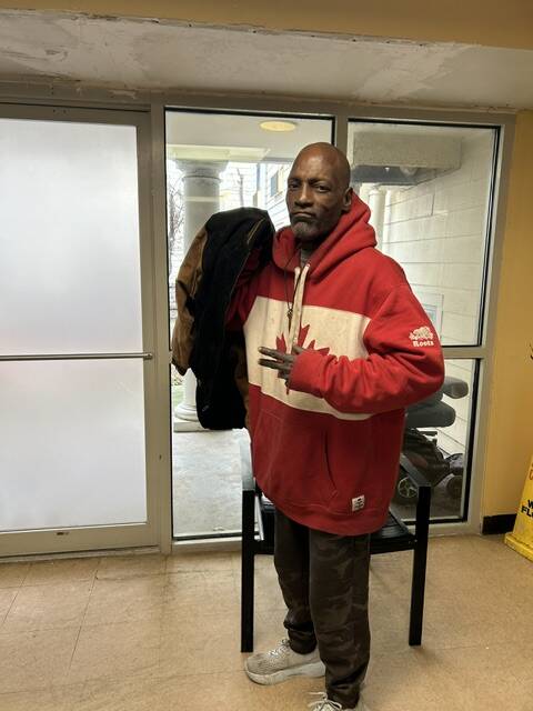 A 3Keys resident of Welcome House in Atlanta tries on his new coat from WSB-TV's Brad Nitz Coat Drive.