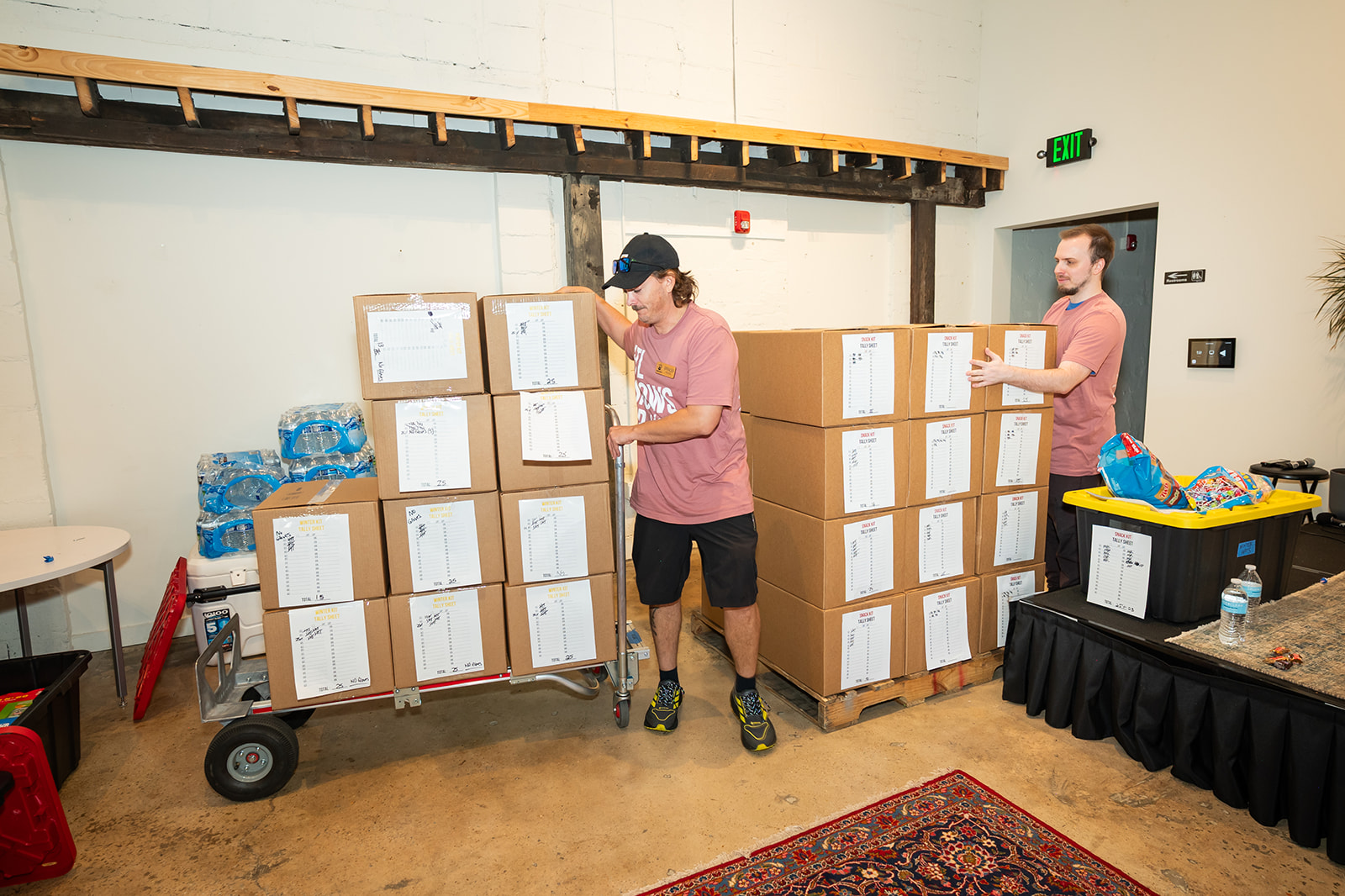 Two volunteers loading up boxes of hygiene kits at Hands On Atlanta Week 2026 benefitting 3Keys and Welcome House