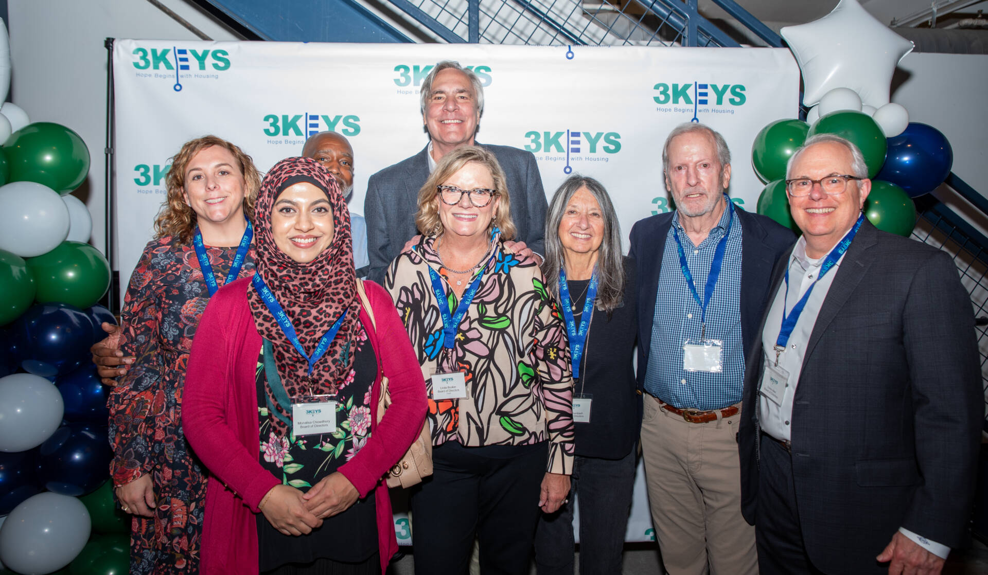 3Keys board of directors takes a group photo in front of a step and repeat during Cheers for a Cause in 2024.