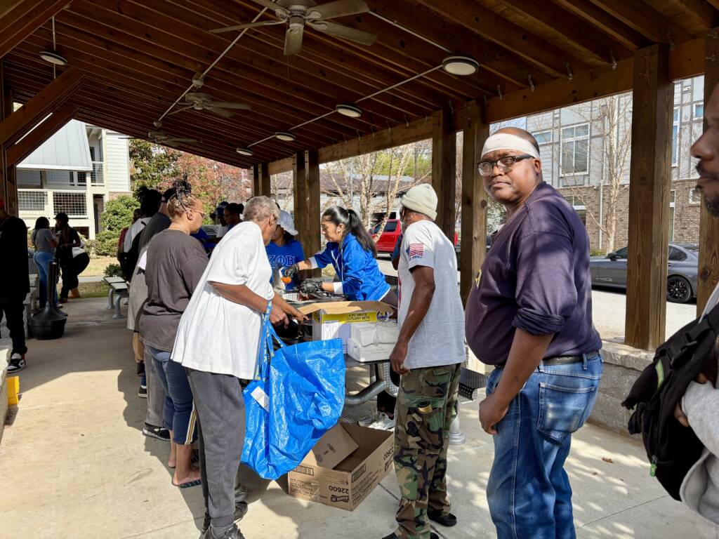 3Keys residents stand in line to receive food during H2H's Annual Feed the Hungry event at the Phoenix House.