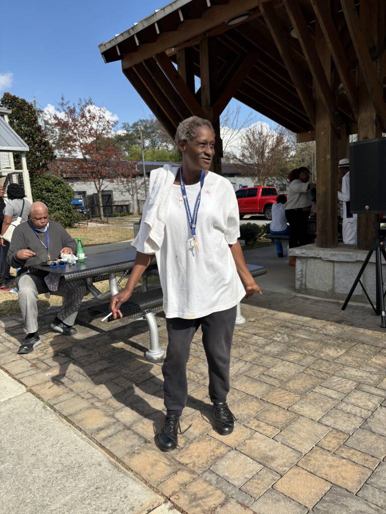 A 3Keys resident stands in the sunshine during H2H's Annual Feed the Hungry event at Phoenix House.