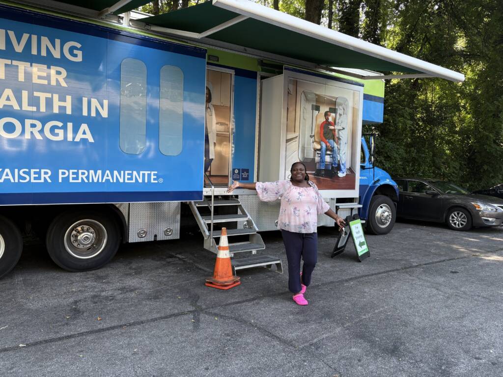 A resident of a 3Keys apartment exits the Kaiser Permanente Mobile Health Van in Atlanta, Georgia.