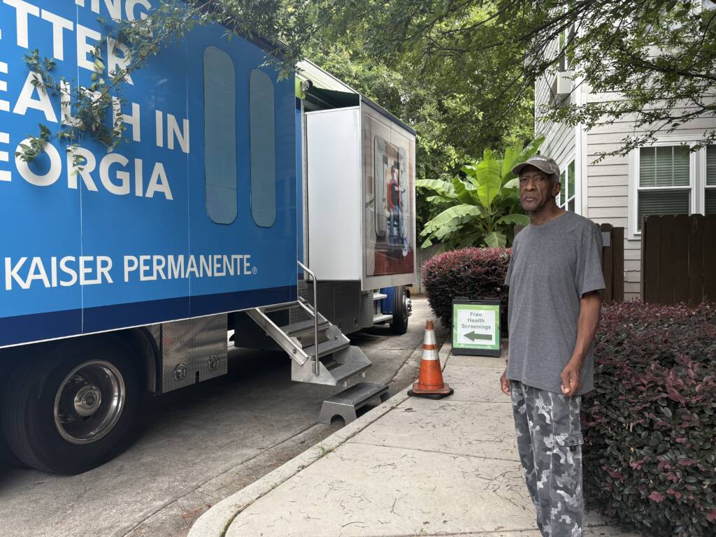 A resident of a 3Keys apartment waits his turn to enter the Kaiser Permanente Mobile Health Van in Atlanta, Georgia.