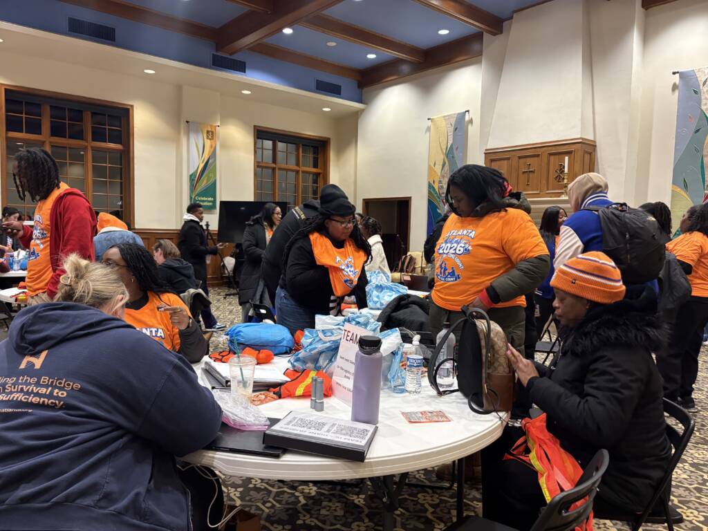 Volunteers get organized around tables for Atlanta's 2026 Point-in-Time Count.